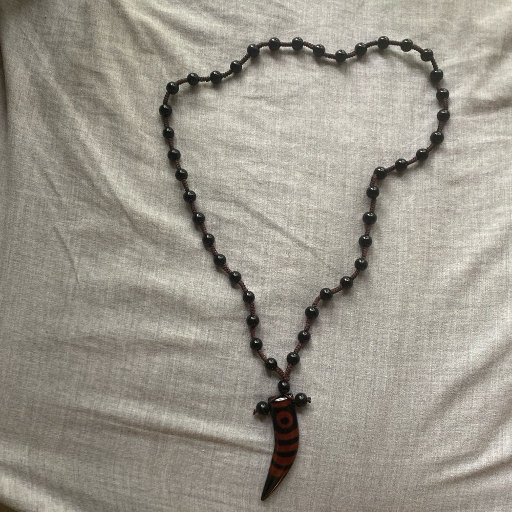 Black and Red Beaded Necklace with Tooth Pendant